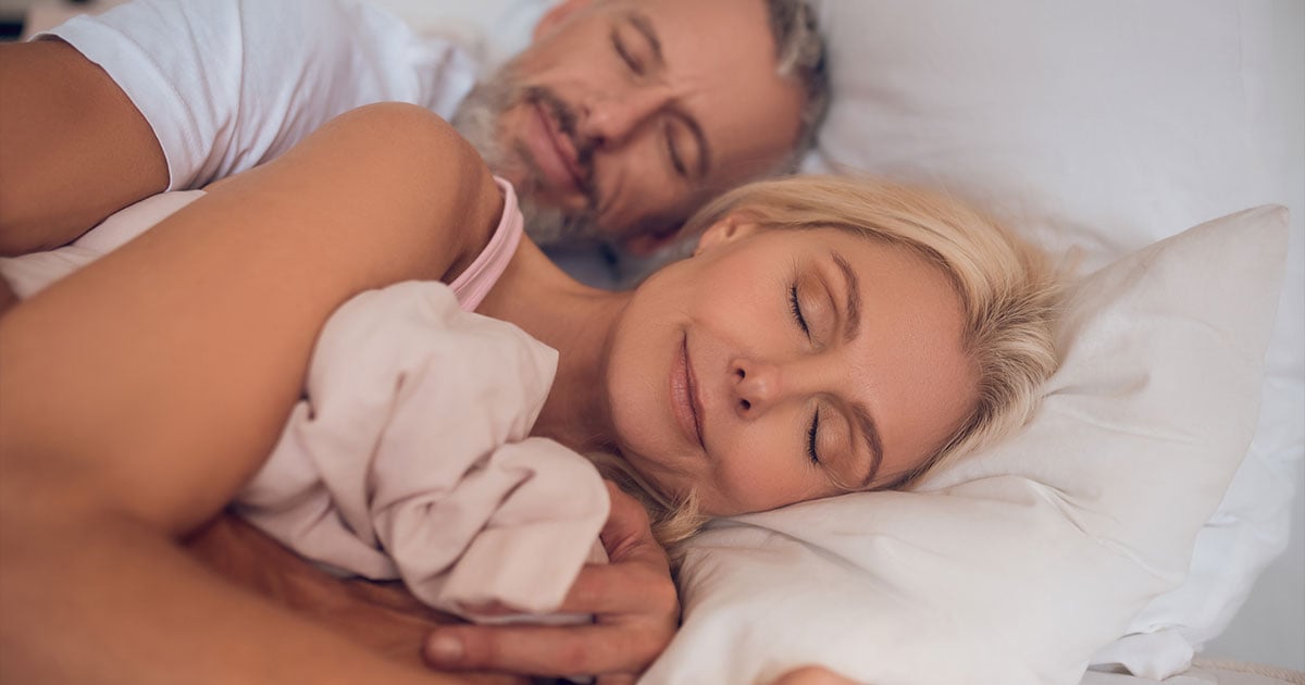 couple sleeping in a bed