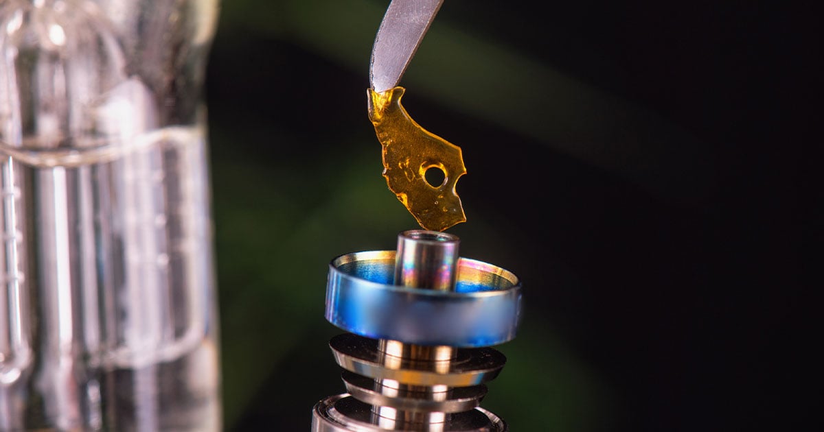 Dabbing tool with small piece of cannabis