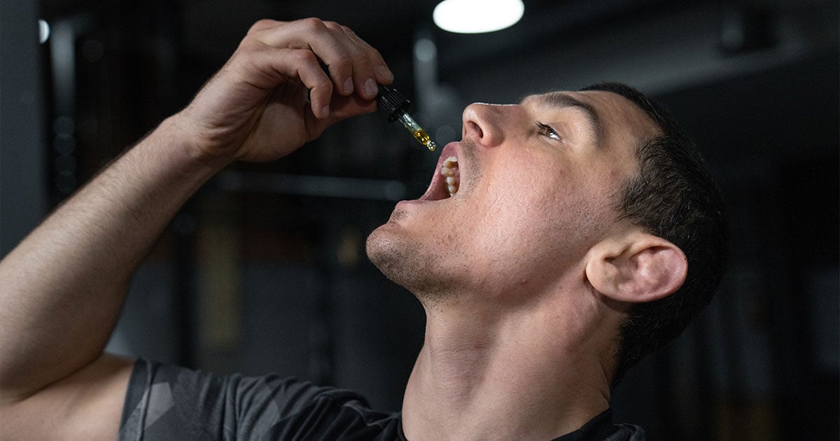 Man taking cbd through droplet