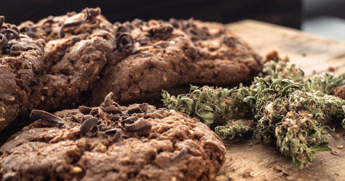 textured-chocolate-hemp-oatmeal-cookies-on-a-wooden-board-picture-id1164504685